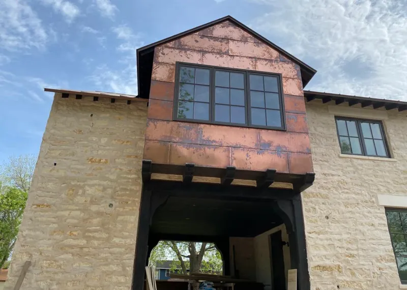 Copper metal panel facade on a stone building for Metal Roof Coating in Mahomet